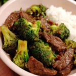 Delicious beef and broccoli stir-fry served in a bowl with colorful vegetables