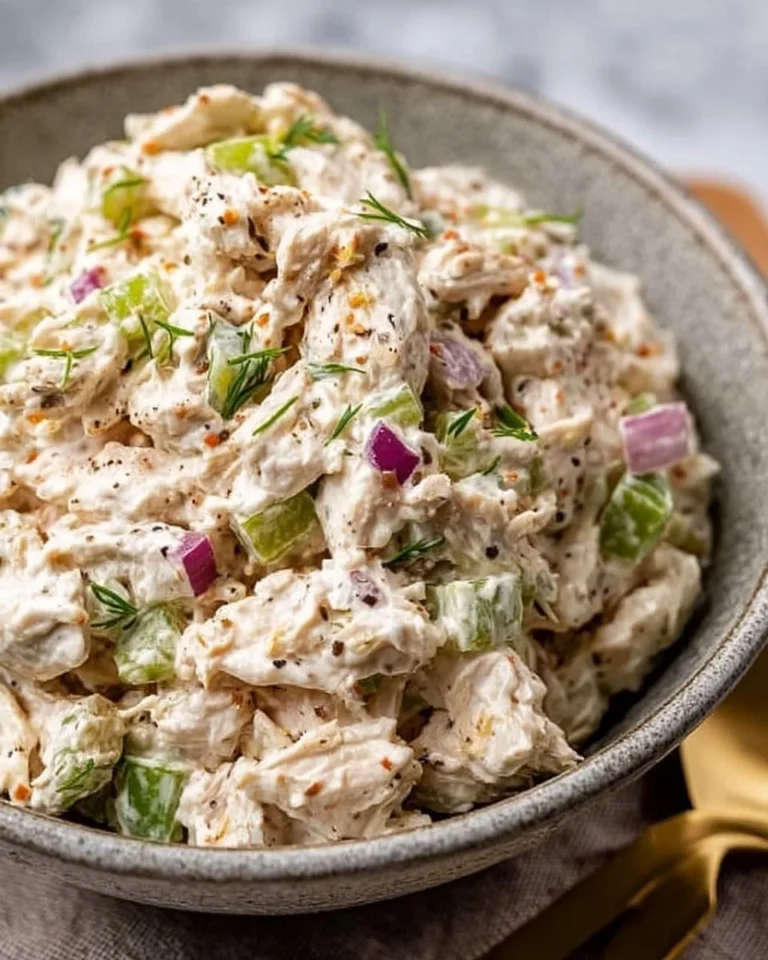 Delicious classic chicken salad in a bowl with fresh ingredients.