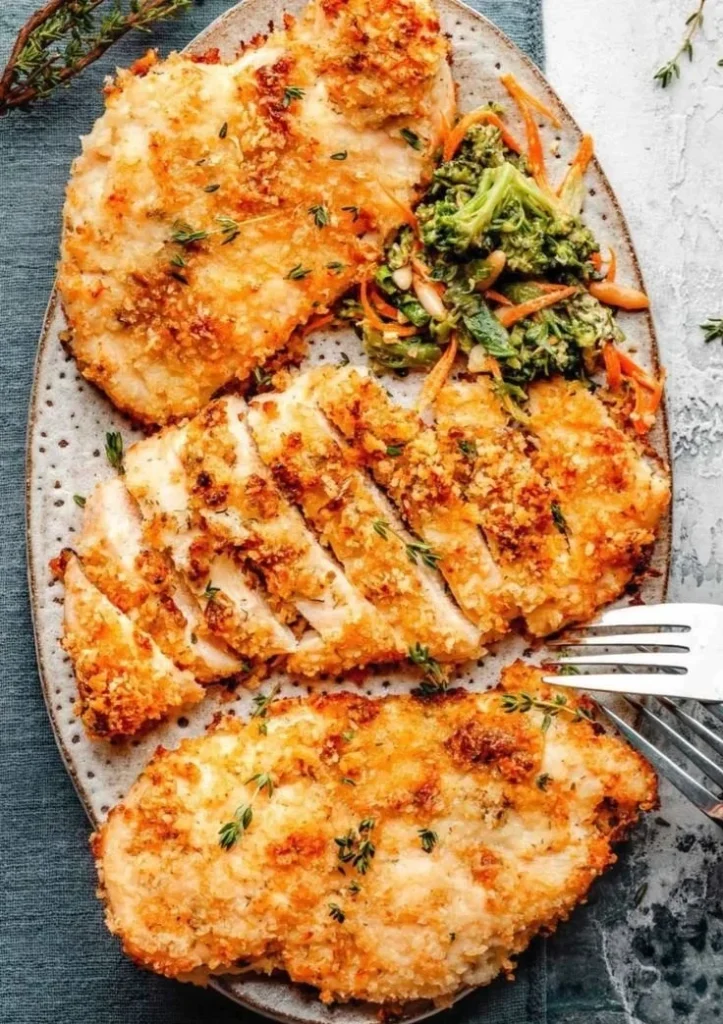 Plate of easy baked ranch chicken garnished with herbs