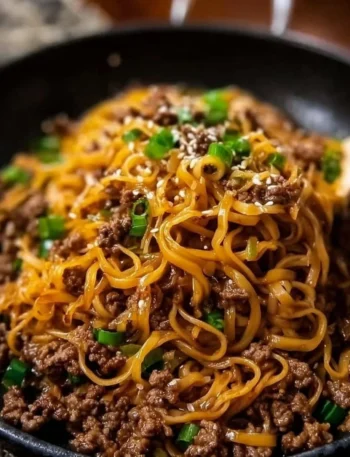 Plate of easy Mongolian beef noodles recipe with herbs and spices