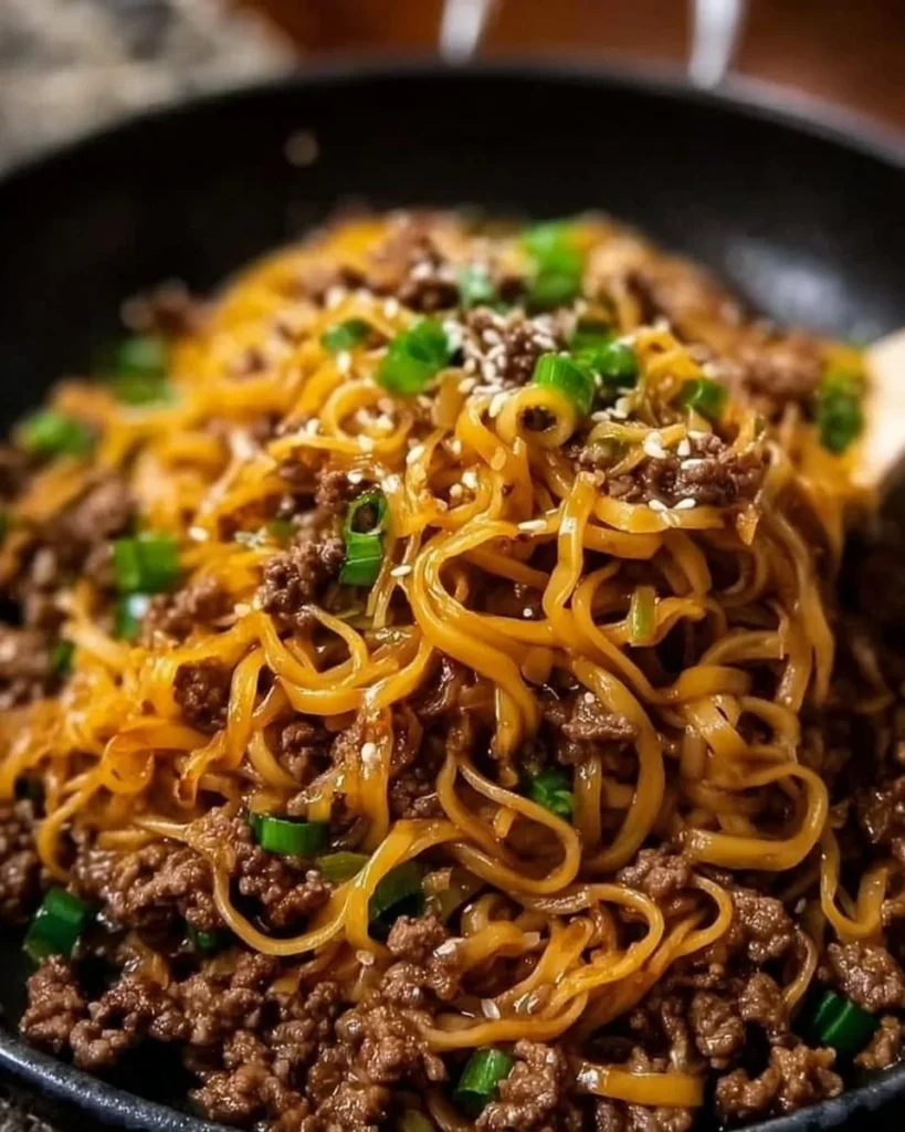 Plate of easy Mongolian beef noodles recipe with herbs and spices