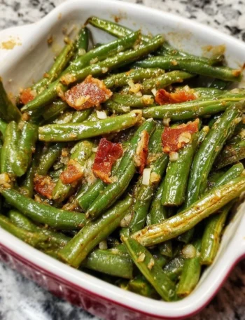 Freshly cooked simple green beans side dish on a plate