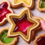 Plate of stained glass sugar cookies with vibrant candy centers