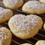 Freshly baked sugar cookies on a cooling rack