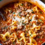 Bowl of easy lasagna soup topped with cheese and fresh basil