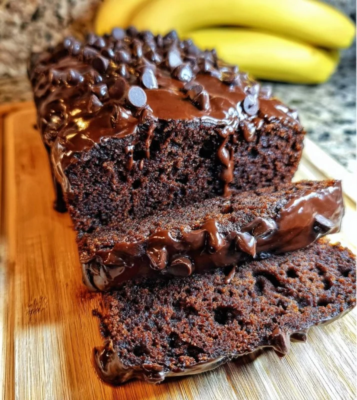 Delicious triple chocolate banana bread topped with chocolate chips