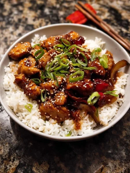 Delicious weeknight sesame teriyaki chicken with ginger rice plated elegantly