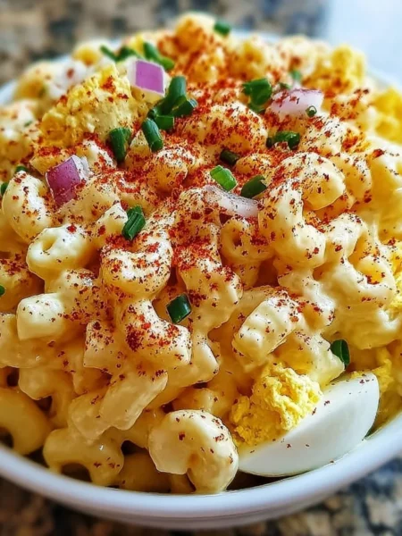 Creamy deviled egg macaroni salad served in a bowl