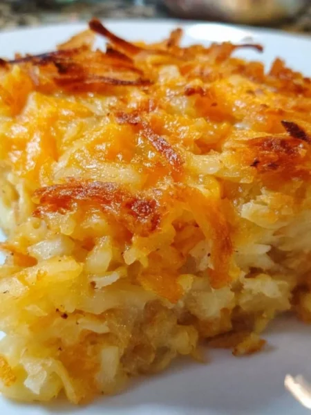 Delicious Hashbrown Casserole served hot with cheese and crispy topping