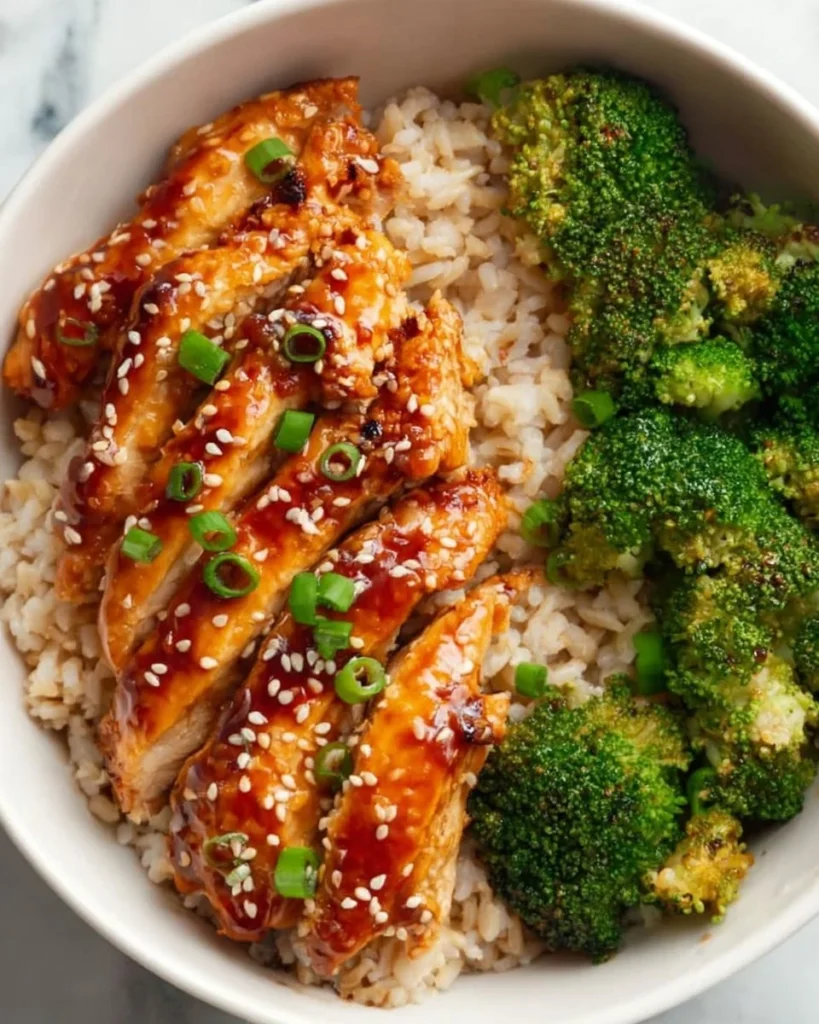 Healthy sticky chicken bowls with fresh vegetables and rice