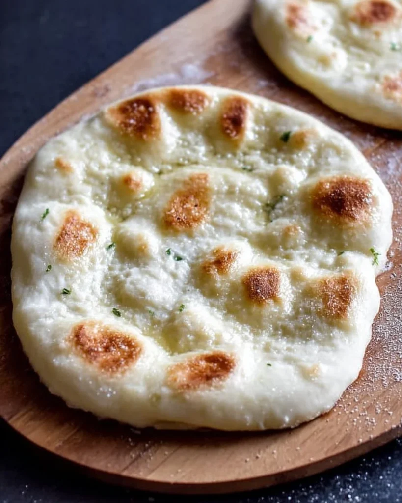 Freshly baked sourdough naan made with sourdough discard