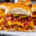 Delicious bacon cheeseburger sliders on a serving platter.