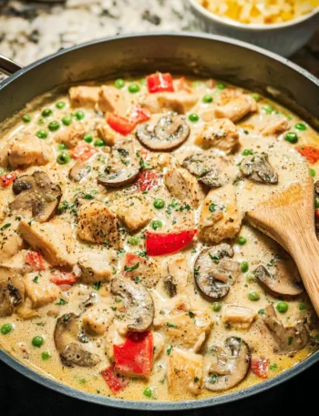 Creamy Chicken a la King served over rice with vegetables