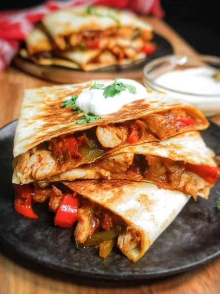 Tasty chicken fajita quesadillas with colorful peppers and melted cheese