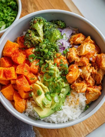 Healthy Chicken Sweet Potato Rice Bowl with vegetables and spices