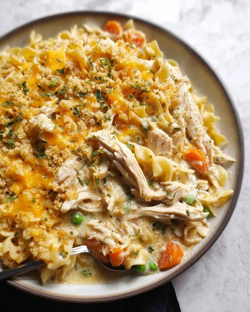 Easy chicken noodle soup casserole ready to serve with fresh parsley garnish